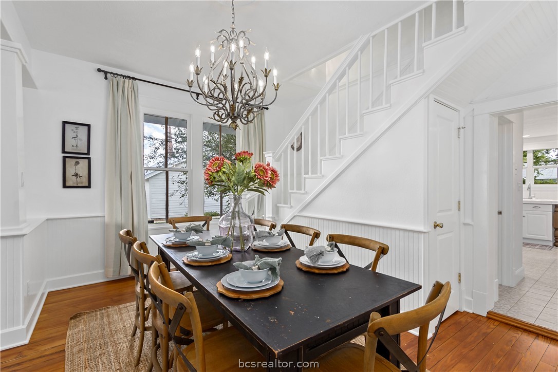 705 South Bryan Avenue Bryan, TX 77803 - Photo 15 of 47 a view of a dining room with furniture and chandelier