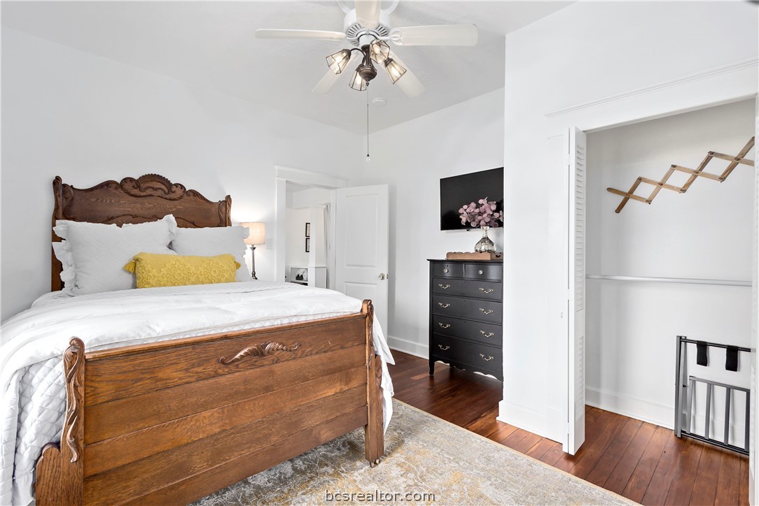 705 South Bryan Avenue Bryan, TX 77803 - Photo 17 of 47 a bedroom with a bed and a view of kitchen