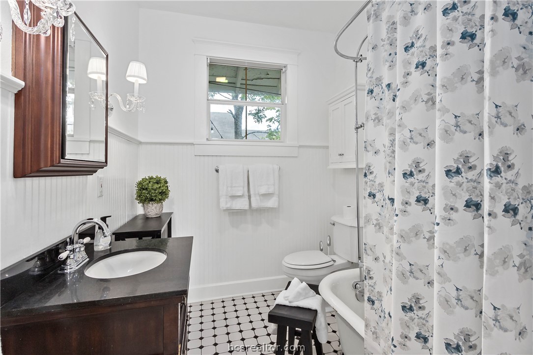 705 South Bryan Avenue Bryan, TX 77803 - Photo 20 of 47 a bathroom with a sink toilet and shower