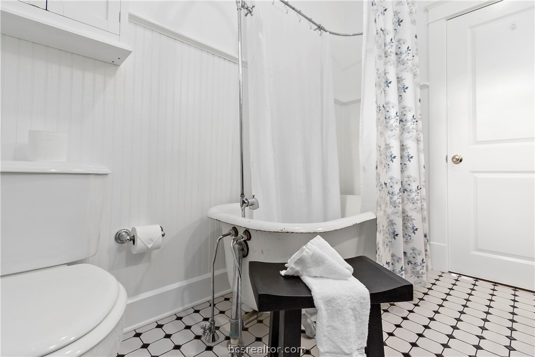 705 South Bryan Avenue Bryan, TX 77803 - Photo 21 of 47 a bathroom with a bathtub and shower