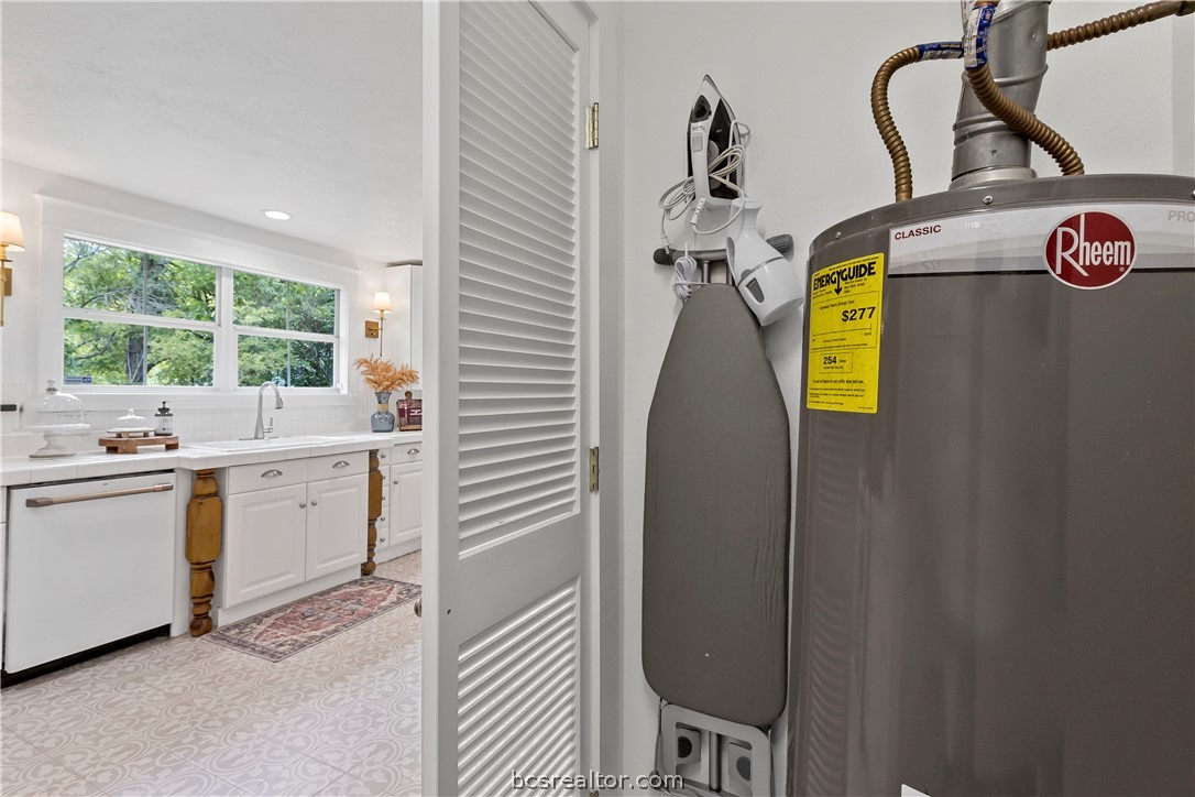 705 South Bryan Avenue Bryan, TX 77803 - Photo 30 of 47 a bathroom with a sink and mirror