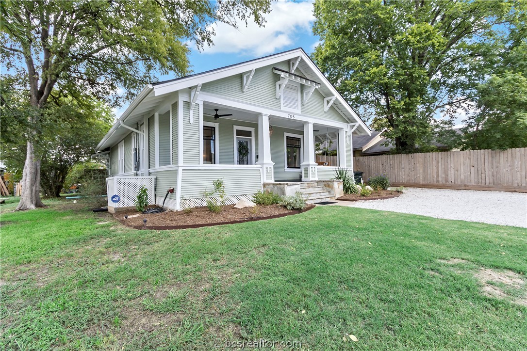705 South Bryan Avenue Bryan, TX 77803 - Photo 3 of 47 a view of a house with a yard patio and a garden