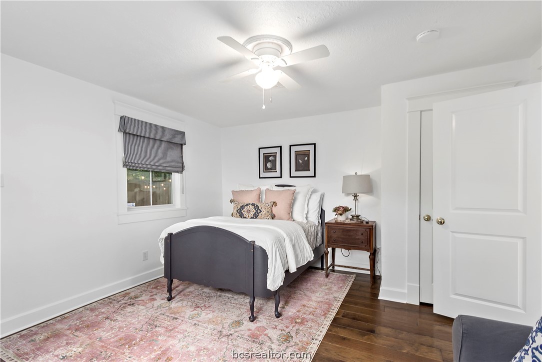 705 South Bryan Avenue Bryan, TX 77803 - Photo 33 of 47 a spacious bedroom with a bed and a ceiling fan