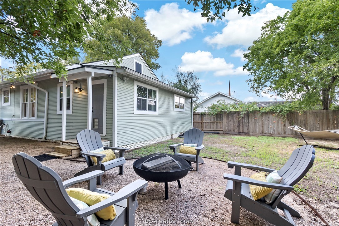 705 South Bryan Avenue Bryan, TX 77803 - Photo 38 of 47 a backyard of a house with barbeque oven table and chairs