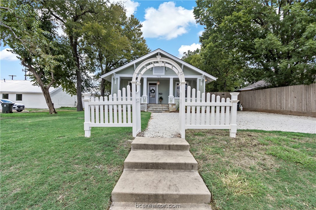 705 South Bryan Avenue Bryan, TX 77803 - Photo 4 of 47 a front view of a house with garden