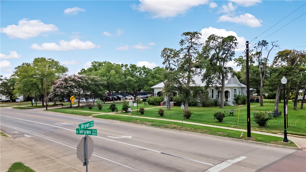705 South Bryan Avenue Bryan, TX 77803 - Photo 46 of 47 a view of a house with a big yard and large trees