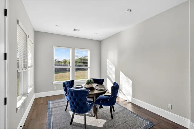 a view of a dining room with furniture window and outside view