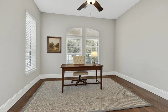 a view of a livingroom with furniture and window