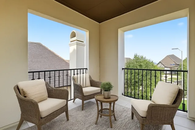 a view of a chair and table in the balcony
