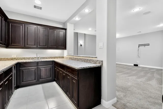 a kitchen with a sink and cabinets
