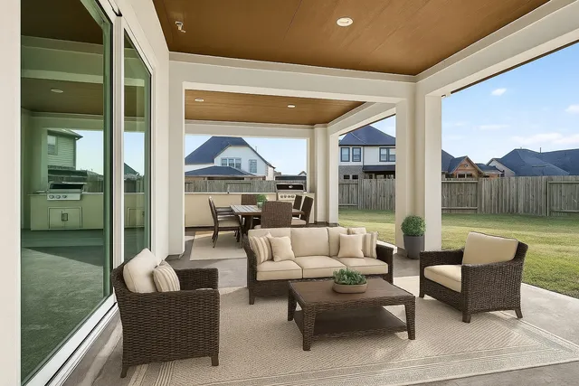 a outdoor living space with furniture and a floor to ceiling window