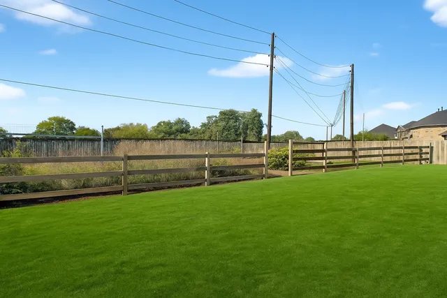 a view of a field with grass