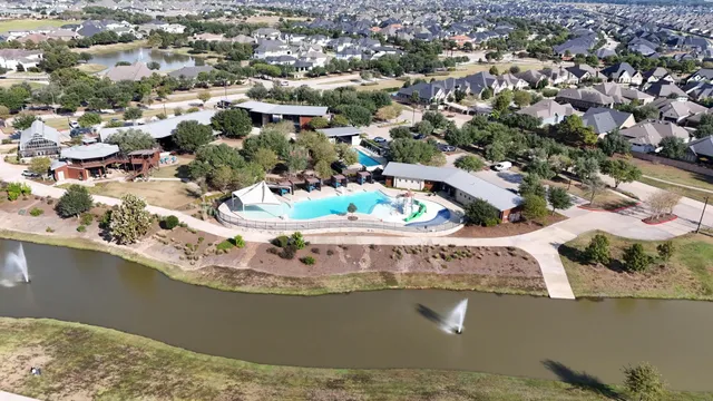 an aerial view of residential houses with outdoor space