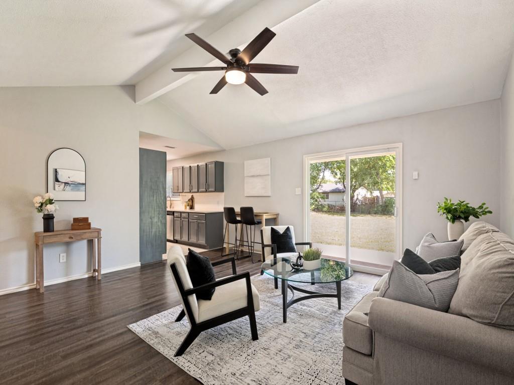 1405 Rambler Road Arlington, TX 76014 - Photo 8 of 26 Open-concept living area featuring a vaulted ceiling and wood-finish flooring
