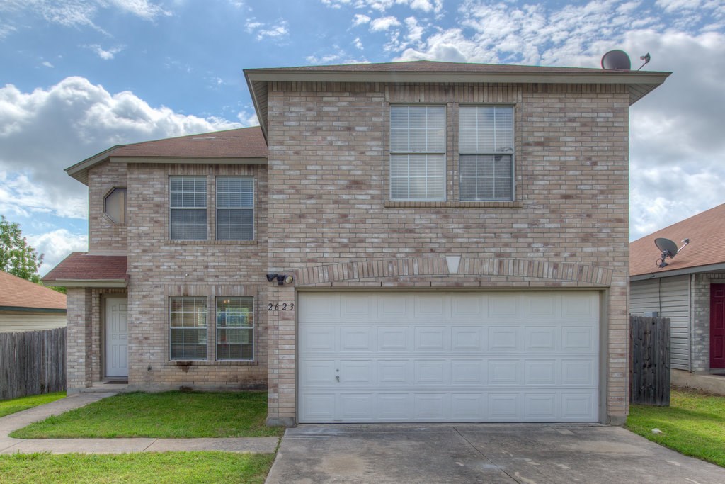 2623 Andres Way Round Rock, TX 78664 - Photo 1 of 15 a front view of a house with a garden