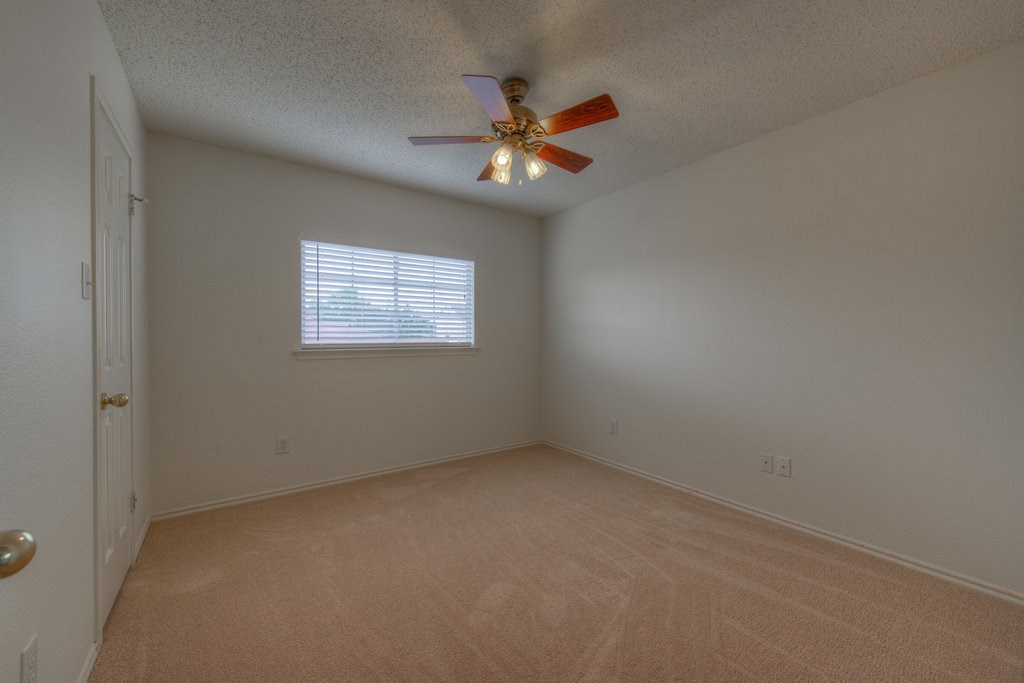 2623 Andres Way Round Rock, TX 78664 - Photo 13 of 15 an empty room with a window and a fan