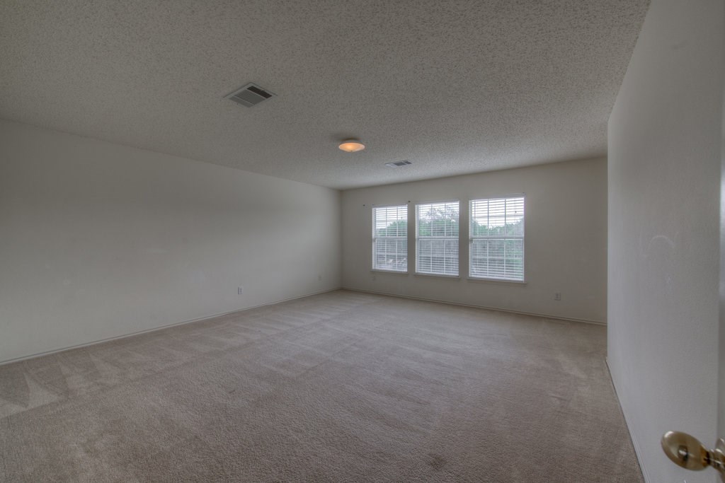 2623 Andres Way Round Rock, TX 78664 - Photo 9 of 15 a view of an empty room with a window