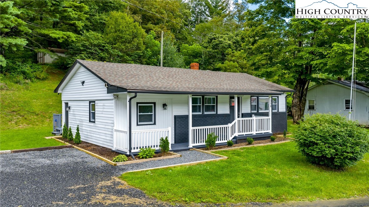 358 Dogget Road West Jefferson, NC 28694 - Photo 1 of 41 a view of a house with a yard plants and large tree