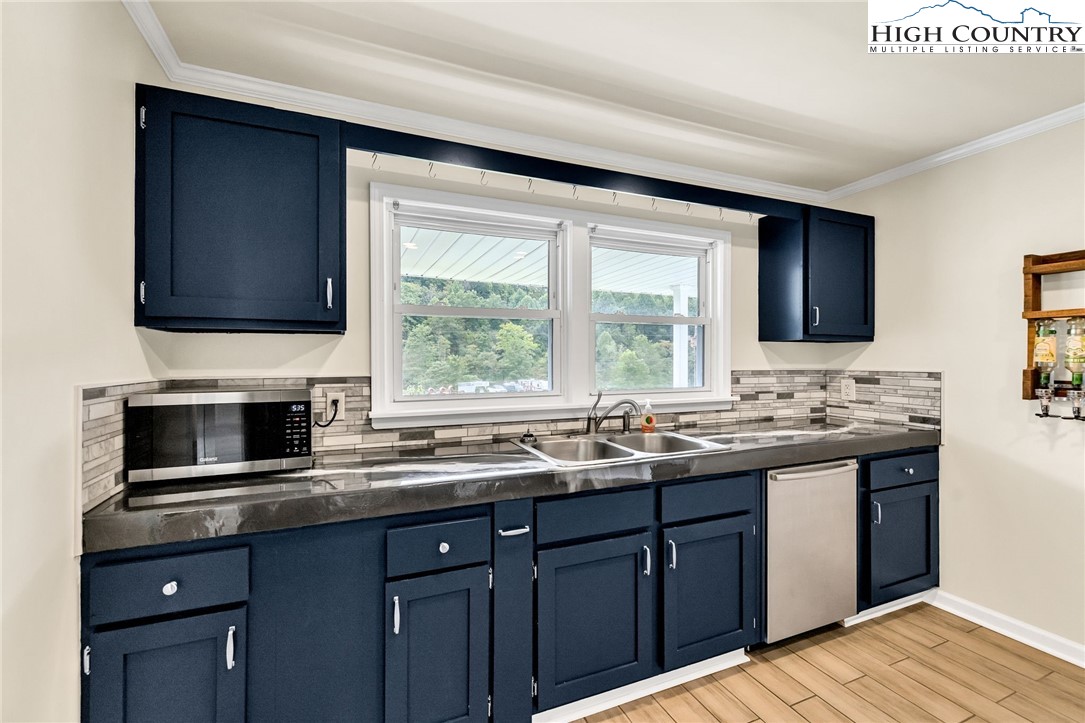 358 Dogget Road West Jefferson, NC 28694 - Photo 13 of 41 a kitchen with a sink stove and microwave