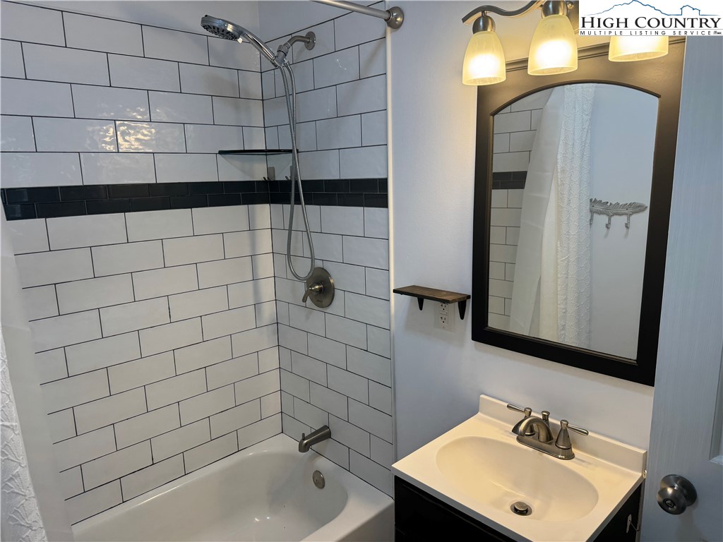 358 Dogget Road West Jefferson, NC 28694 - Photo 20 of 41 a bathroom with a sink a toilet and shower