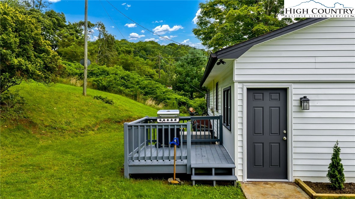 358 Dogget Road West Jefferson, NC 28694 - Photo 30 of 41 a view of a chair and table in backyard of the house
