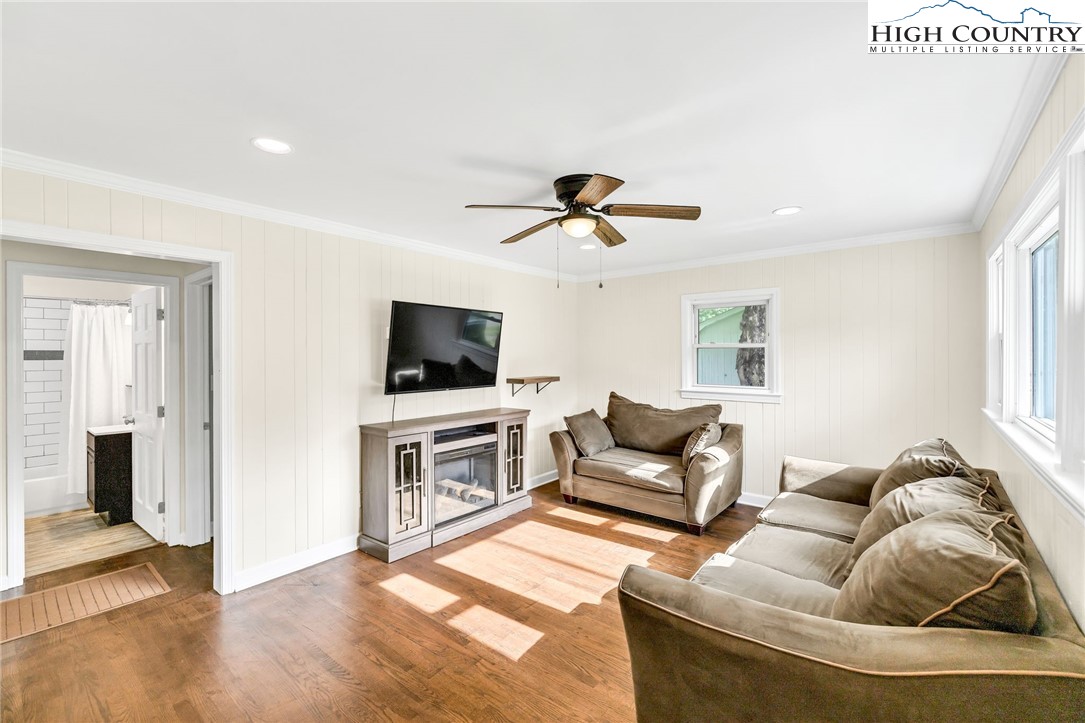 358 Dogget Road West Jefferson, NC 28694 - Photo 5 of 41 a living room with furniture and a flat screen tv