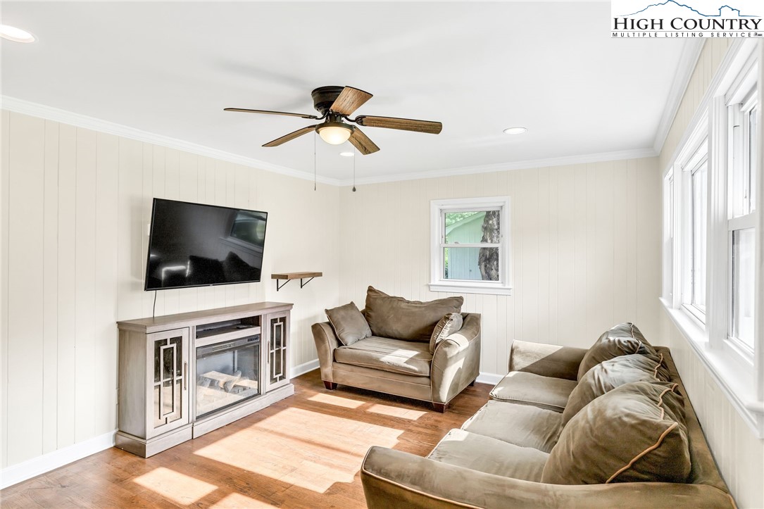 358 Dogget Road West Jefferson, NC 28694 - Photo 7 of 41 a living room with furniture and a flat screen tv