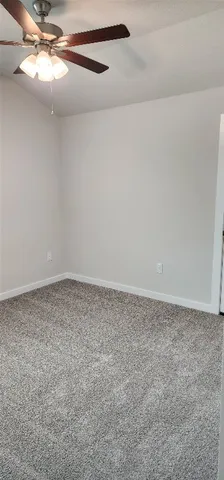 a view of a big room with carpet