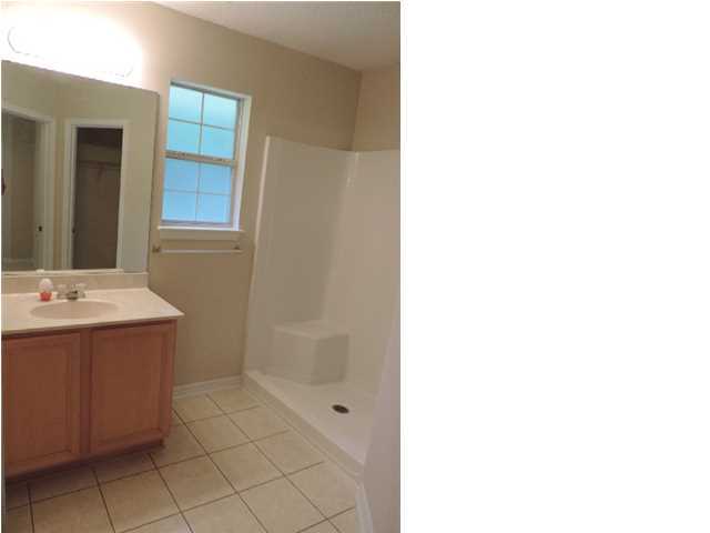 328 Beacon Way Miramar Beach, FL 32550 - Photo 12 of 22 a bathroom with a sink and mirror