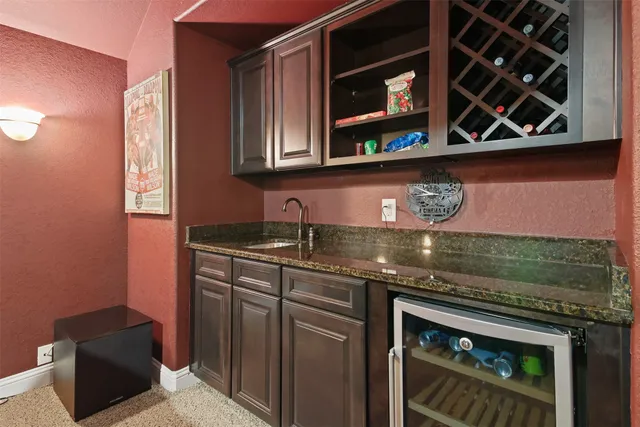 a kitchen with stainless steel appliances granite countertop a stove and a microwave