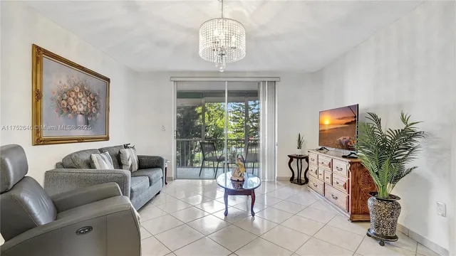a view of a livingroom with furniture window and wooden floor