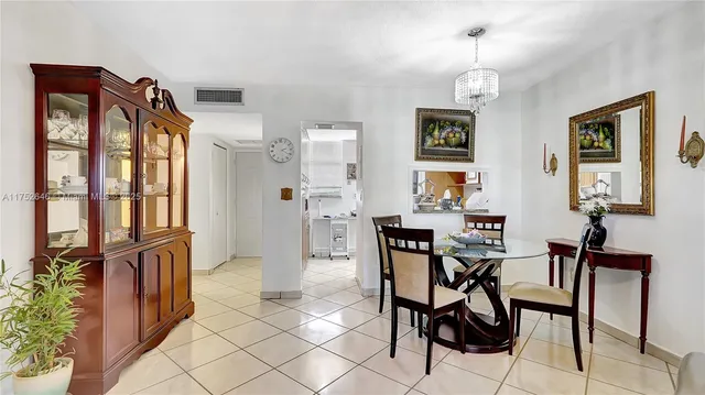 a kitchen with stainless steel appliances granite countertop a refrigerator and a stove
