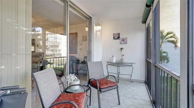 a view of a balcony with chairs