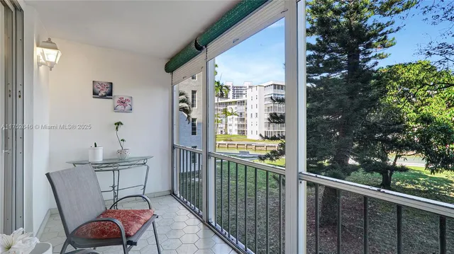 a view of a yard with plants and a trees