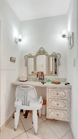 a bathroom with a sink a toilet and shower curtain