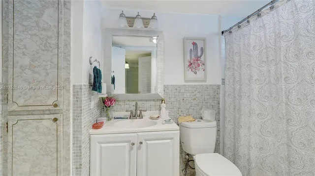 a view of a kitchen with sink and wooden floor