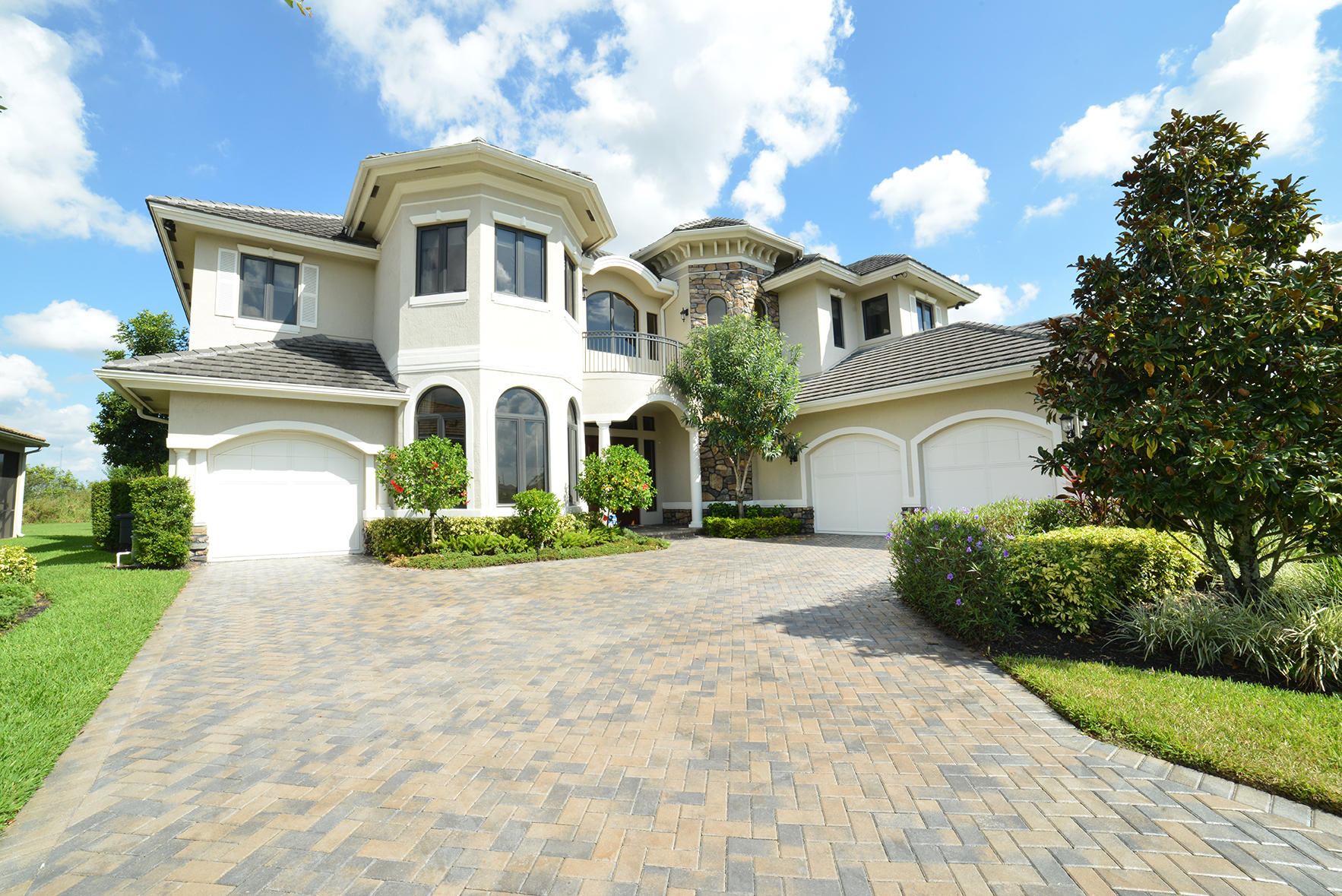 9812 Equus Circle Boynton Beach, FL 33472 - Photo 2 of 39 a front view of a house with a garden
