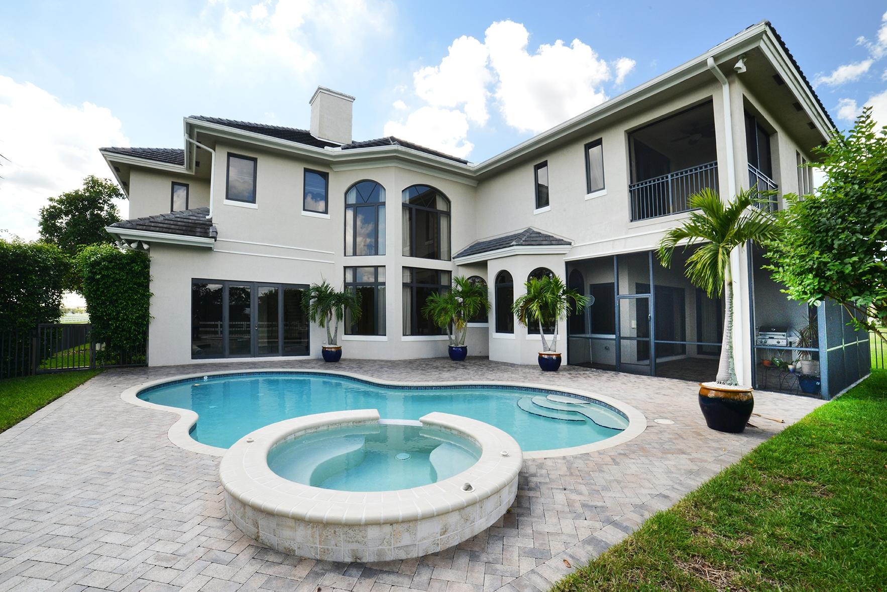 9812 Equus Circle Boynton Beach, FL 33472 - Photo 4 of 39 a view of a house with a swimming pool and furniture