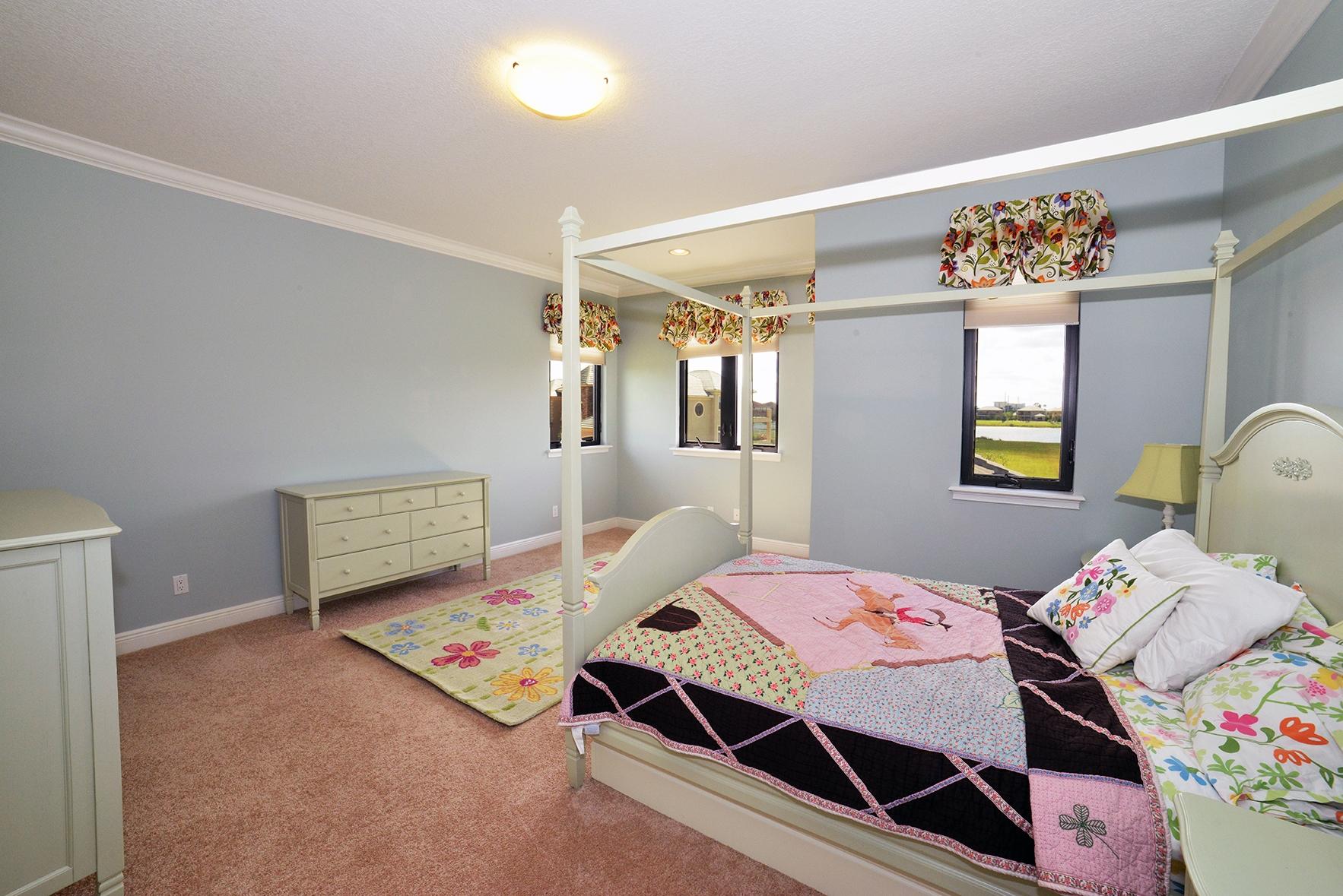 9812 Equus Circle Boynton Beach, FL 33472 - Photo 35 of 39 a bedroom with a bed and wooden floor