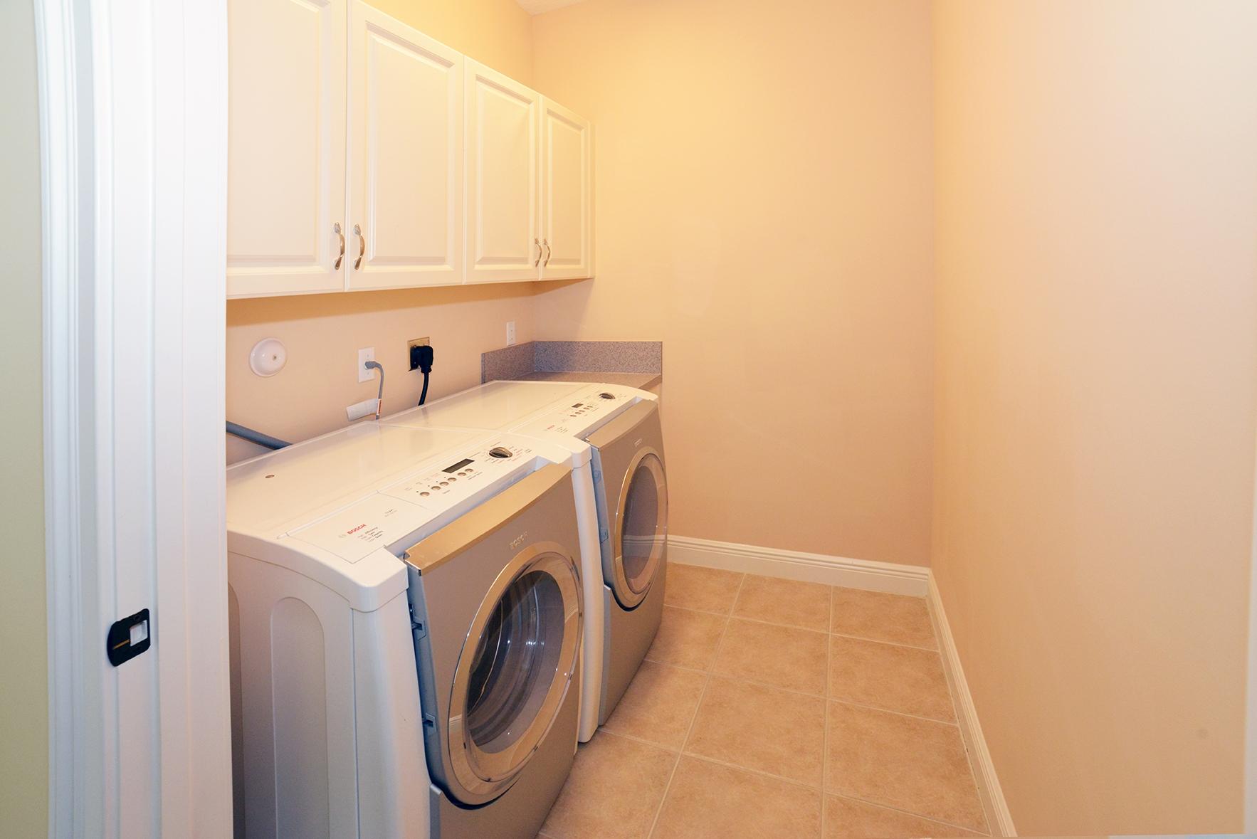 9812 Equus Circle Boynton Beach, FL 33472 - Photo 39 of 39 a utility room with dryer and washer