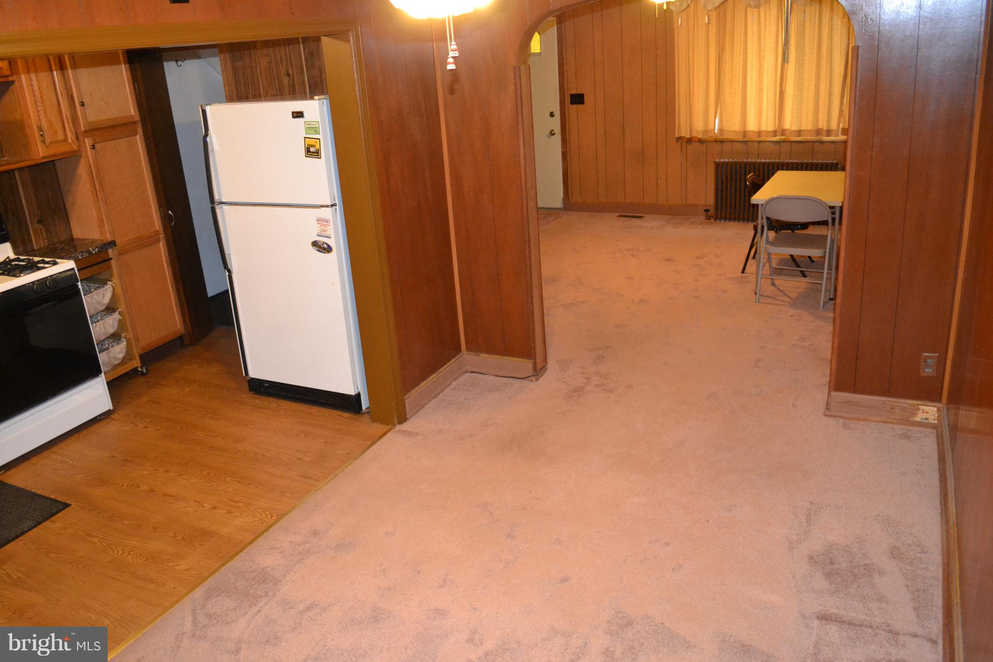 226 West Meadow Road Baltimore, MD 21225 - Photo 4 of 21 Kitchen, Dining Room and Living Room