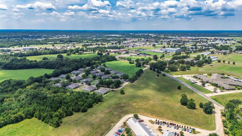 83-ac Stillhouse Road Paris, TX 75462 - Photo 20 of 22 an aerial view of residential building and lake