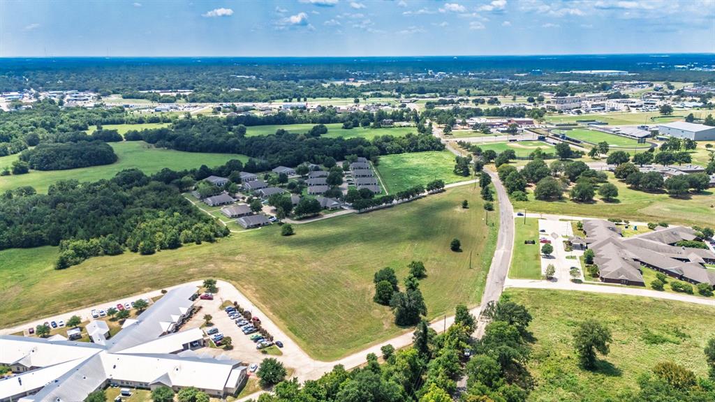 83-ac Stillhouse Road Paris, TX 75462 - Photo 21 of 22 an aerial view of residential houses with outdoor space