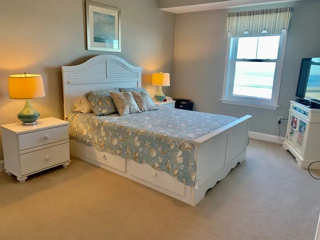 a room with a window and a flat screen tv