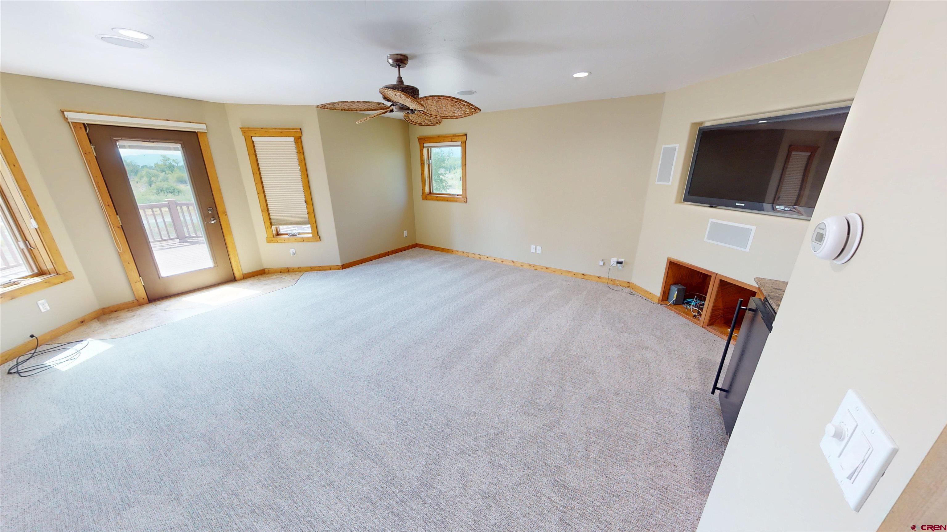 7857 Oxbow Loop Alamosa, CO 81101 - Photo 18 of 24 a view of a livingroom with a flat screen tv
