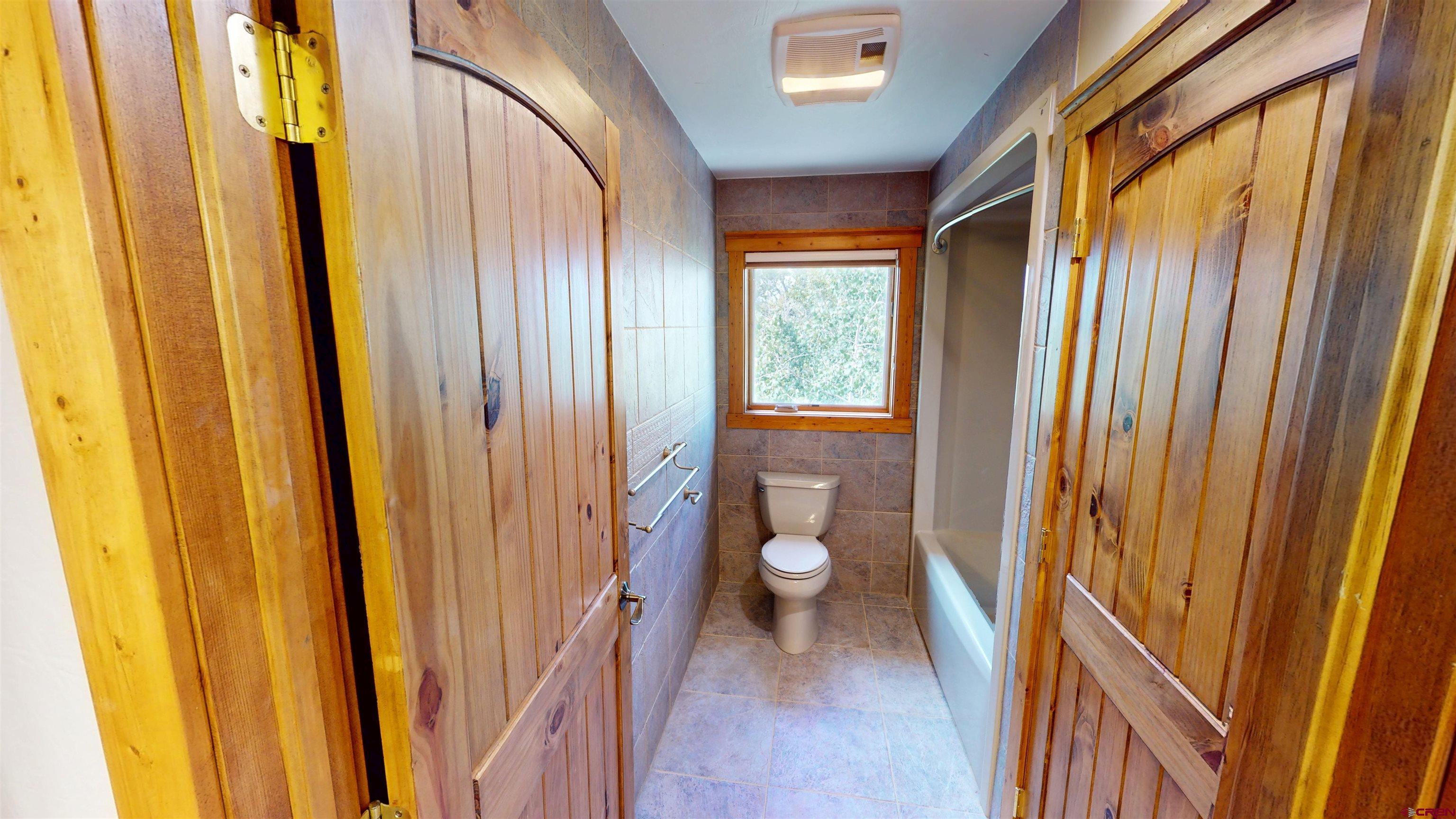 7857 Oxbow Loop Alamosa, CO 81101 - Photo 19 of 24 a view of a bathroom with a sink and a toilet
