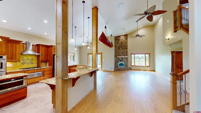a view of a living room and kitchen with furniture