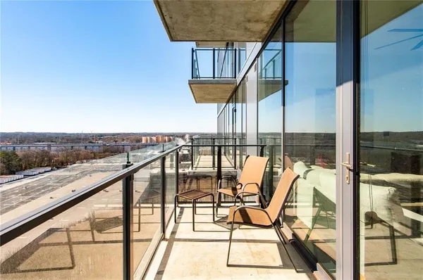 a view of a balcony with chairs