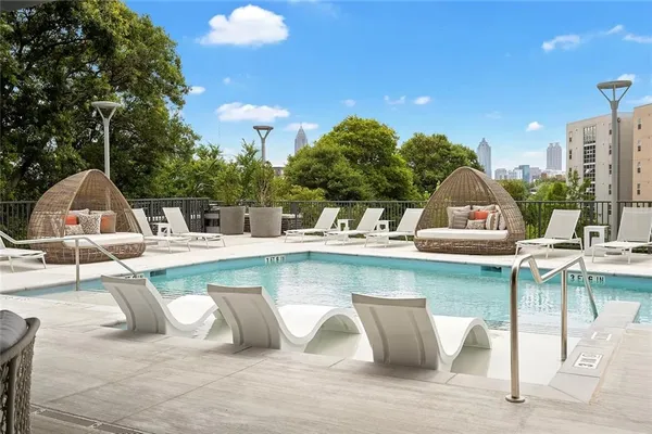 a view of a swimming pool with a lounge chairs