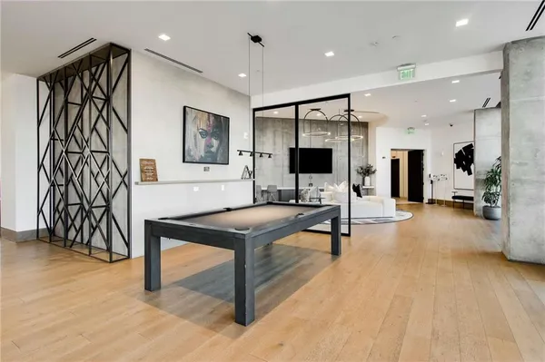 a living room with fireplace furniture and a flat screen tv